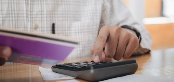 An accountant calculate tax using a calculator