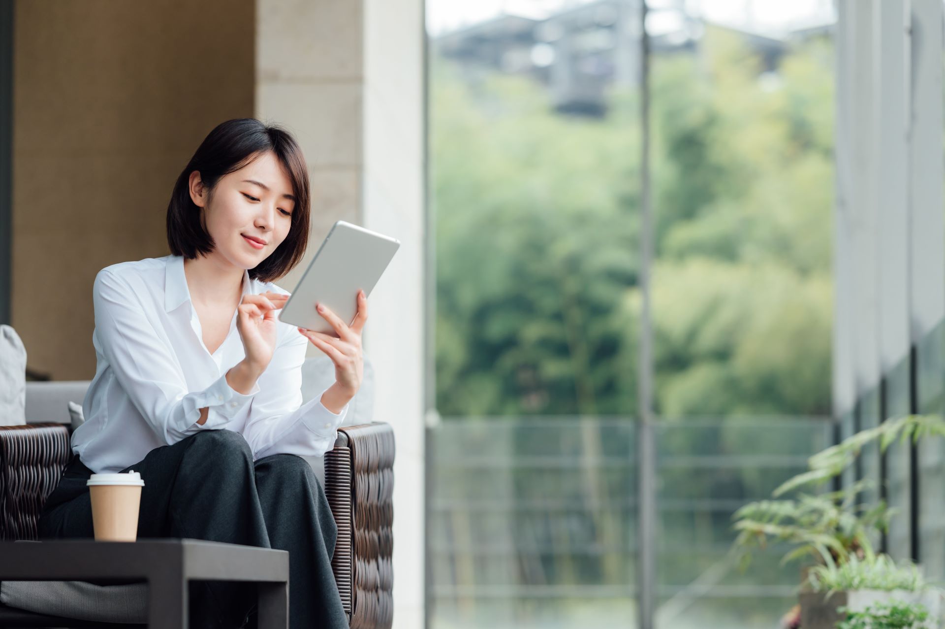 A business woman checking her ipad