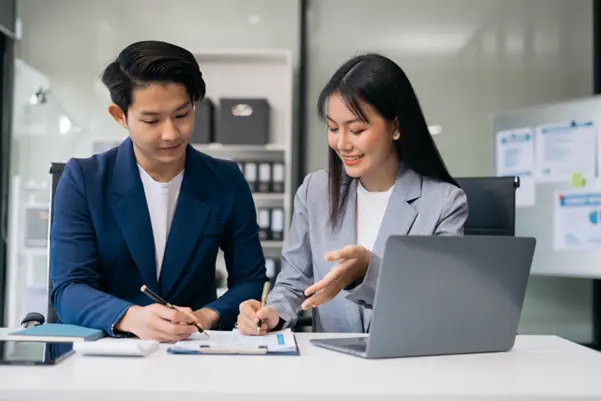 A company secretary guides a professional to register his company A company secretary guides a professional to register his company