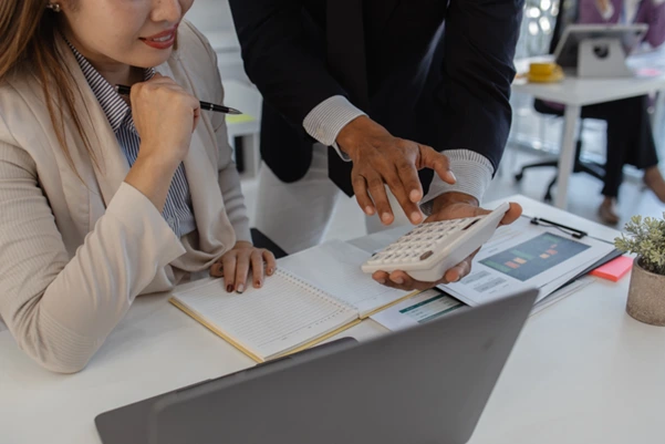 Accountant reviewing financial documents and tax returns to identify common IRAS audit triggers.