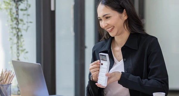 A woman calculating a company's chargeable income