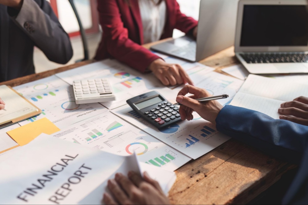 Business professionals reviewing financial reports and documents during a tax audit review meeting